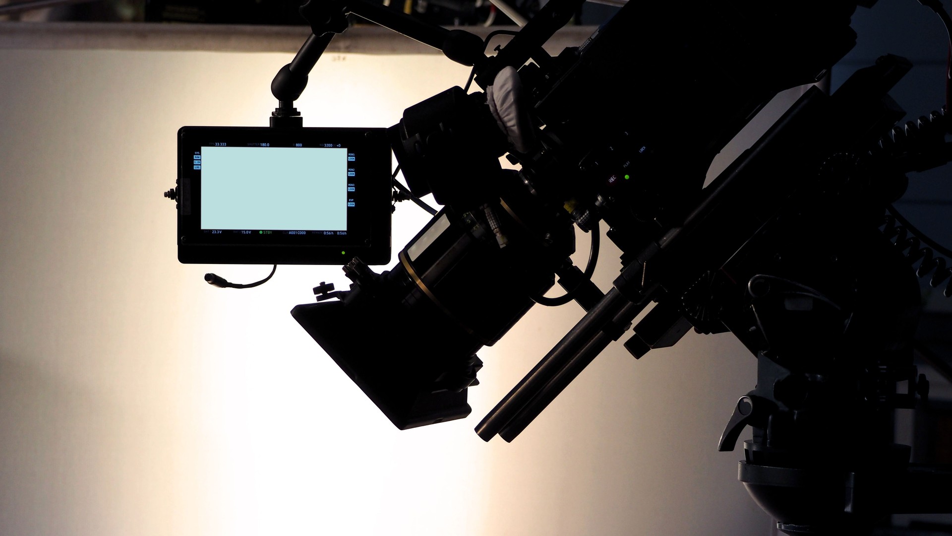 Behind the scenes of video production and movie crew team working in silhouette