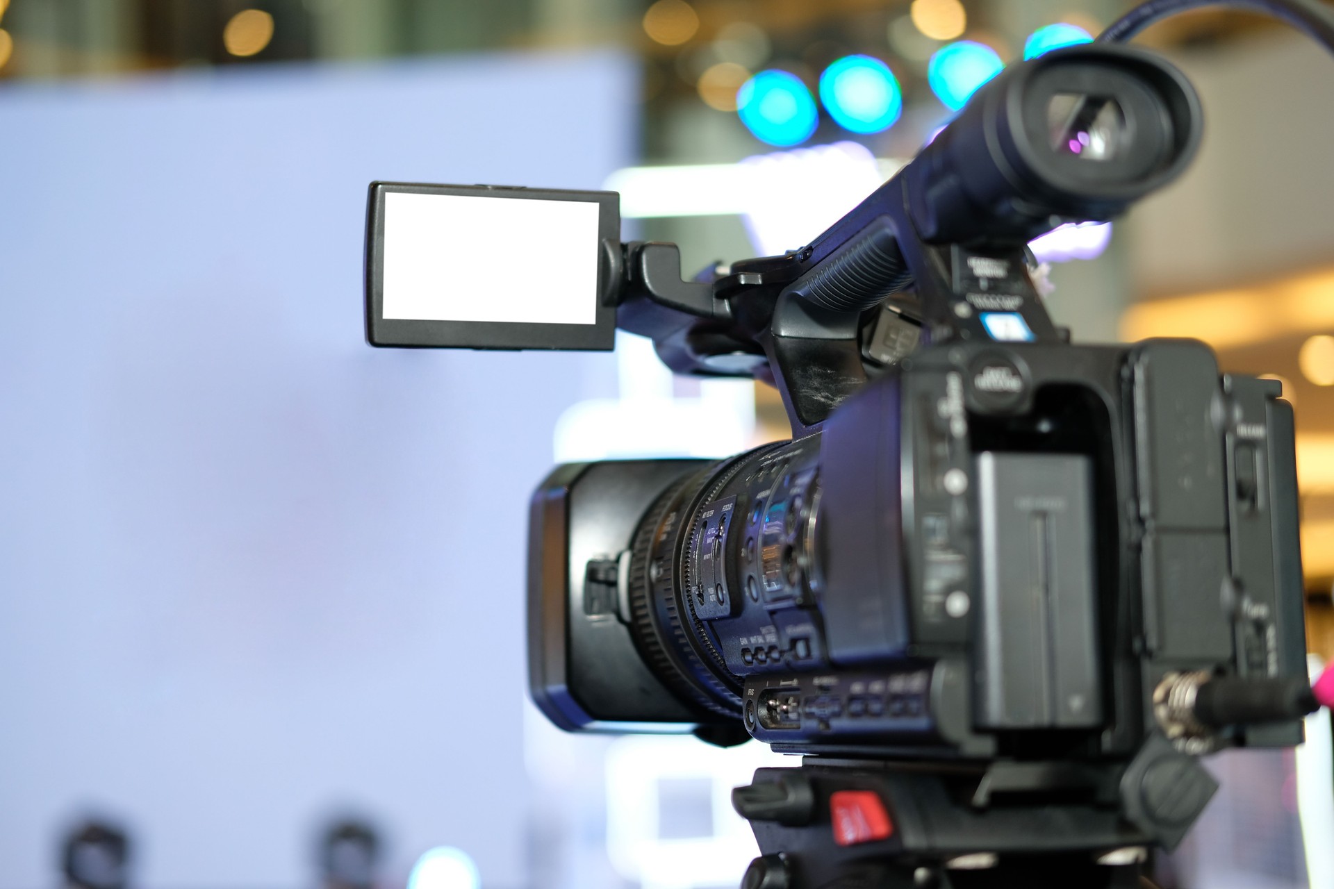 video production camera recording live event on stage. television social media broadcasting seminar conference